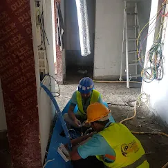 IP Care technicians pulling and dressing riser cabling at Al Jeel Tower