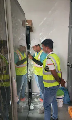 IP Care engineers routing cabling at an access-controlled entrance at Yas Driving Academy